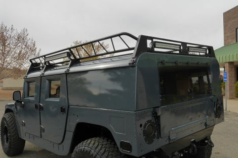 Powder-coated humvee roof rack with LED light bars attached